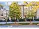 Three-story townhome with neutral-toned exterior and landscaping at 633 Broadview Pl, Atlanta, GA 30324