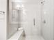 Modern shower with glass enclosure and built-in seat at 633 Broadview Pl, Atlanta, GA 30324