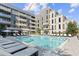 Resort-style pool with plenty of lounge chairs and umbrellas at 775 Juniper Ne St # 111, Atlanta, GA 30308