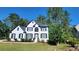 Two-story house with white exterior, black accents, and landscaping at 227 Scenic View Lane Ln, Stone Mountain, GA 30087