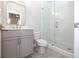Modern bathroom with glass shower and gray vanity at 280 Briscoe Way # 38, Alpharetta, GA 30009