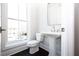 Modern powder room with pedestal sink and dark hardwood floors at 280 Briscoe Way # 38, Alpharetta, GA 30009