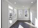 Bright bedroom with dark hardwood floors and access to a balcony at 280 Briscoe Way # 38, Alpharetta, GA 30009