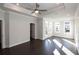 Main bedroom with dark hardwood floors, large windows and private access to a balcony at 280 Briscoe Way # 38, Alpharetta, GA 30009