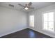 Bright bedroom with dark hardwood floors and ceiling fan at 280 Briscoe Way # 38, Alpharetta, GA 30009