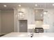Modern kitchen with white cabinets, quartz countertops and island at 280 Briscoe Way # 38, Alpharetta, GA 30009