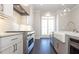 White shaker cabinets, farmhouse sink, and stainless steel appliances at 280 Briscoe Way # 38, Alpharetta, GA 30009