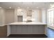 Modern kitchen with white cabinets, quartz countertops and island at 280 Briscoe Way # 38, Alpharetta, GA 30009