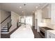Open concept kitchen with island and stainless steel appliances at 280 Briscoe Way # 38, Alpharetta, GA 30009