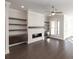 Living room with fireplace and built-in shelving at 280 Briscoe Way # 38, Alpharetta, GA 30009