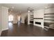 Open concept living room with hardwood floors and fireplace at 280 Briscoe Way # 38, Alpharetta, GA 30009