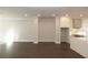 Open living area with hardwood floors and kitchen at 280 Briscoe Way # 38, Alpharetta, GA 30009