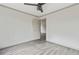 Bright bedroom with ceiling fan and grey vinyl flooring at 539 Easton Dr, Locust Grove, GA 30248