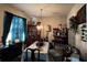 Formal dining room with a table, chairs, and display cabinets at 6599 Woodwell Dr, Union City, GA 30291