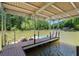 Covered boat dock with plenty of space for boats and jet skis at 835 Timber Lake Trl, Cumming, GA 30041