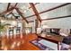 Open concept living area with hardwood floors and vaulted ceiling at 835 Timber Lake Trl, Cumming, GA 30041