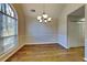 Formal dining room featuring hardwood floors and an arched window at 3930 Mallard Way, Cumming, GA 30028