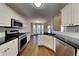 Updated kitchen boasting stainless steel appliances and granite countertops at 3930 Mallard Way, Cumming, GA 30028