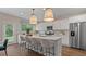 Modern kitchen with stainless steel appliances and an island at 2711 Dolce Rd, Dacula, GA 30019