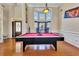 Spacious living area with a pool table and large windows at 3125 Esplanade Sw Cir, Atlanta, GA 30311