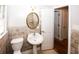 Charming bathroom with pedestal sink and tile flooring at 5075 Winters Chapel Rd, Atlanta, GA 30360