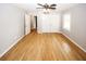 Spacious bedroom with hardwood floors and ceiling fan at 5075 Winters Chapel Rd, Atlanta, GA 30360