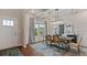 Dining room with wood floors, chandelier and wainscoting at 2427 Dolce Rd, Dacula, GA 30019