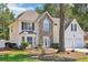 Two-story house with stone accents and a two-car garage at 277 Edison Dr, Stockbridge, GA 30281