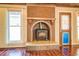 Brick fireplace with mosaic tile detail and wood mantel at 138 Mcdonald Rd, Covington, GA 30014