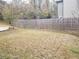 Private backyard with wooden fence and small tree at 3010 W Jackson Way, Austell, GA 30106