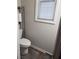 Small bathroom with toilet and shelf at 3010 W Jackson Way, Austell, GA 30106