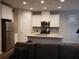 Modern kitchen with stainless steel appliances and island at 3010 W Jackson Way, Austell, GA 30106