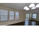 Dining area with dark hardwood floors, neutral walls, and access to a deck at 2786 Alix Way, Lithia Springs, GA 30122