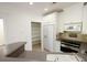 Bright kitchen with white cabinets, stainless steel appliances, and a pantry at 4100 Paces Walk # 1301, Atlanta, GA 30339