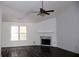 Living room with hardwood floors, fireplace, and vaulted ceiling at 1098 Chase Creek Ct, Lawrenceville, GA 30044