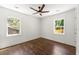 Bright bedroom with hardwood floors and two large windows at 2133 Trailwood Rd, Decatur, GA 30032