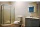 Clean bathroom with corner shower, toilet, and vanity with sink at 4010 Princeton Sw Pl, Atlanta, GA 30331