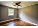 Bedroom with hardwood floors, ceiling fan, and window at 4010 Princeton Sw Pl, Atlanta, GA 30331