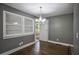 Bright dining room with hardwood floors, gray walls, and a chandelier at 4010 Princeton Sw Pl, Atlanta, GA 30331