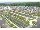 Aerial view of a community with houses, gardens, and walking paths at 4002 Moody Ln, Woodstock, GA 30188