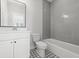 Modern bathroom with gray tile and white vanity at 4002 Moody Ln, Woodstock, GA 30188