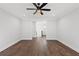 Spacious bedroom with hardwood floors and access to upper hallway at 4002 Moody Ln, Woodstock, GA 30188
