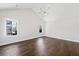 Spacious bedroom with hardwood floors and multiple windows at 4002 Moody Ln, Woodstock, GA 30188
