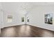 Bright bedroom featuring hardwood floors and vaulted ceiling at 4002 Moody Ln, Woodstock, GA 30188