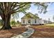 Community clubhouse with stone pathway and large tree at 4002 Moody Ln, Woodstock, GA 30188