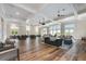 Spacious community room with hardwood floors and comfortable seating at 4002 Moody Ln, Woodstock, GA 30188