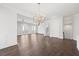 Open concept dining room with hardwood floors and chandelier at 4002 Moody Ln, Woodstock, GA 30188