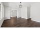 Spacious dining room featuring hardwood floors and chandelier at 4002 Moody Ln, Woodstock, GA 30188