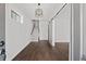 Bright entryway with hardwood floors, staircase, and barn door at 4002 Moody Ln, Woodstock, GA 30188