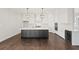 Spacious kitchen with island, white cabinets, and high-end appliances at 4002 Moody Ln, Woodstock, GA 30188